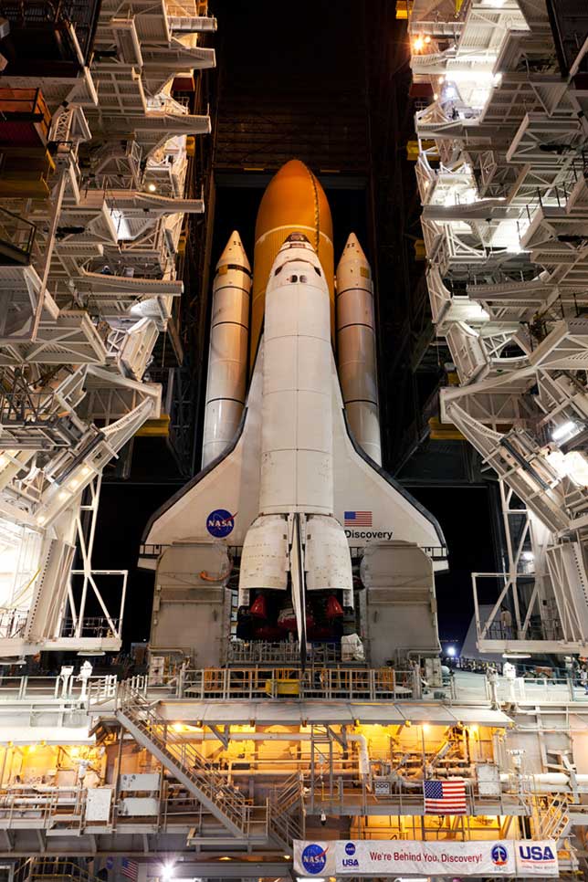 Space-Shuttle-Discovery-STS-133-in-VAB-at-night.jpg