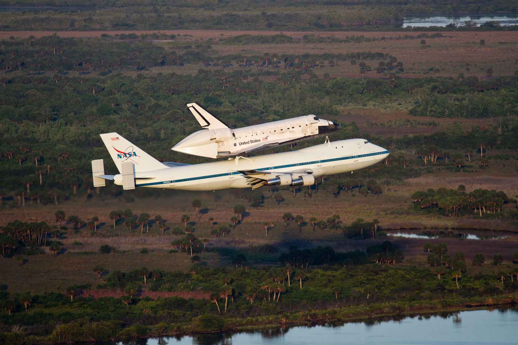 Retired NASA space shuttle being transported to museum via airplane