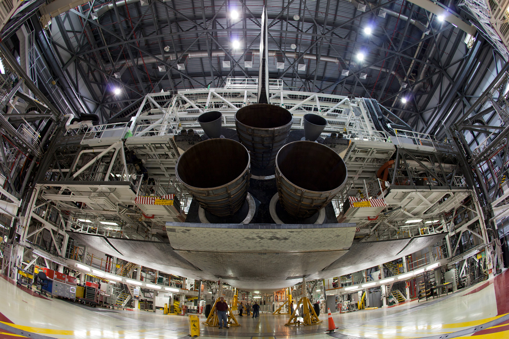wide shot of bottom of NASA space shuttle inside VAB