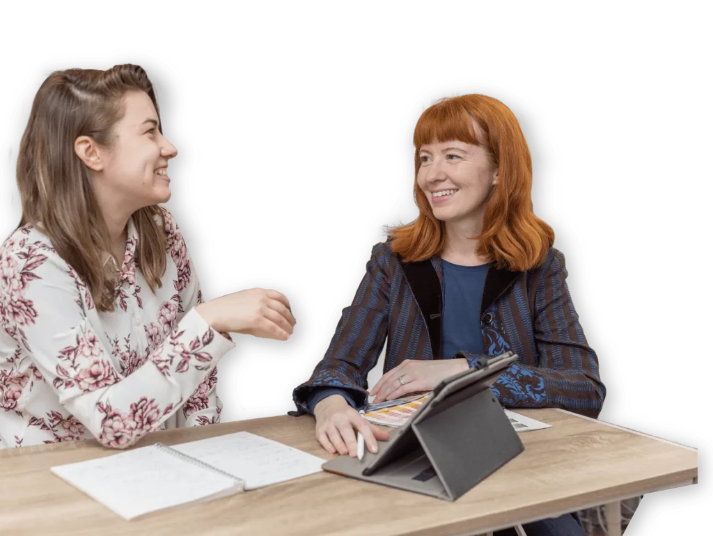 Cecilia and Catherine discussing marketing services and solutions